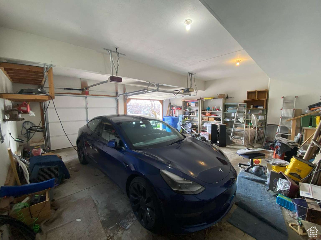 Garage featuring a garage door opener