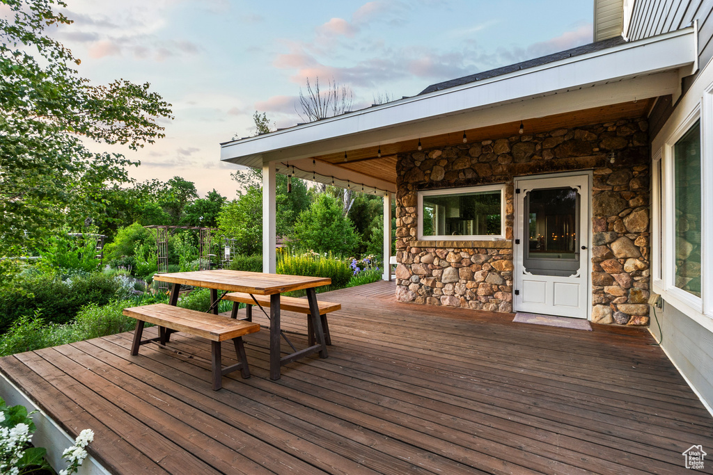 Wooden terrace featuring outdoor dining space