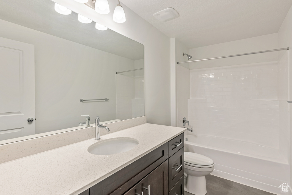 Full bath with toilet, vanity, and shower / bathtub combination