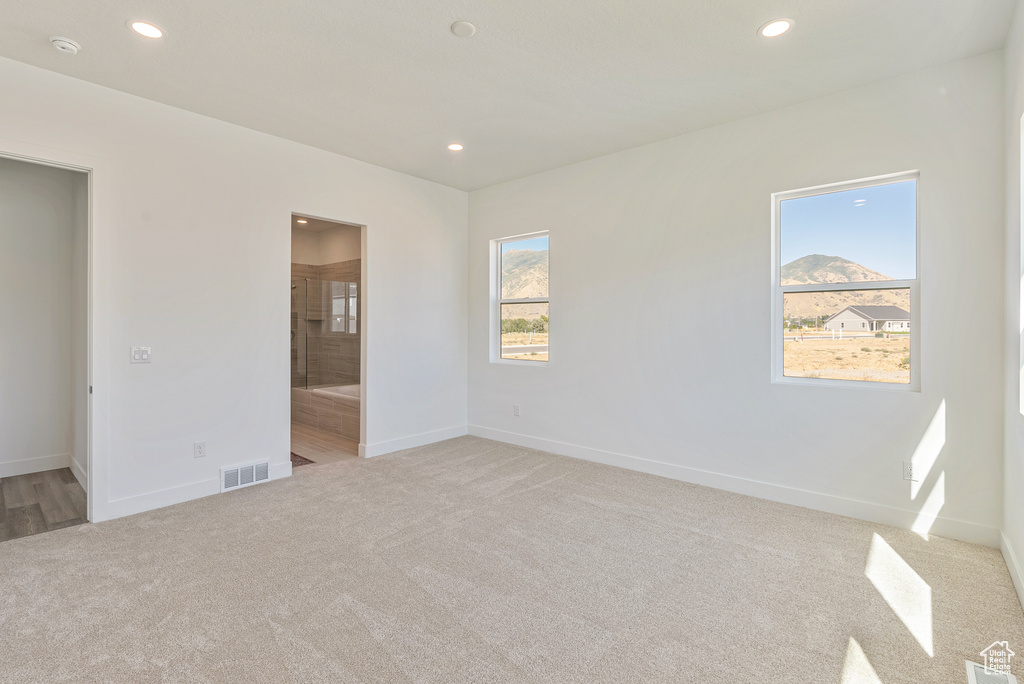 Unfurnished bedroom featuring visible vents, recessed lighting, and carpet