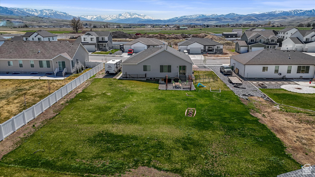 Aerial view of residential area featuring a mountainous background