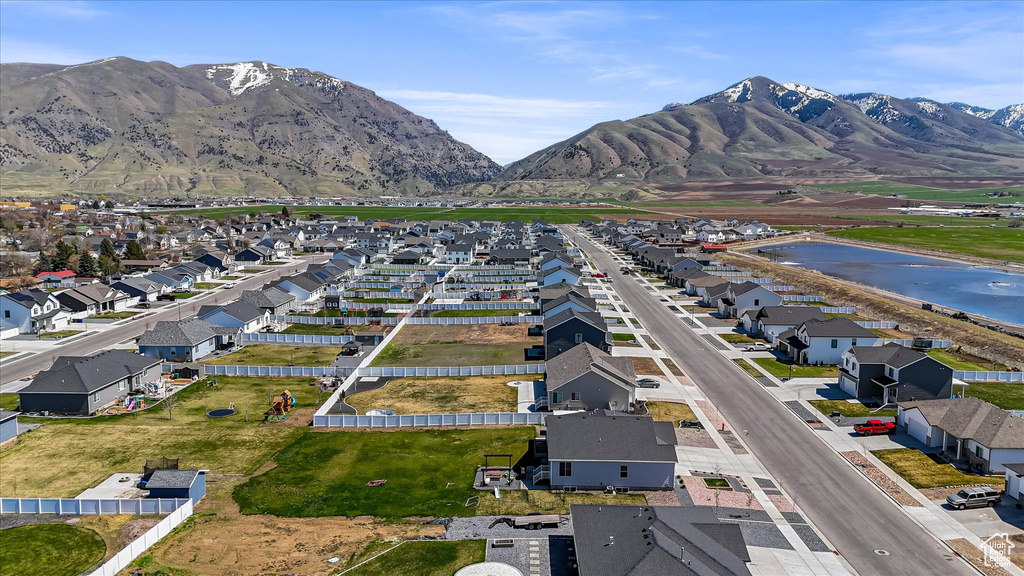 View of property location featuring a mountain backdrop and nearby suburban area