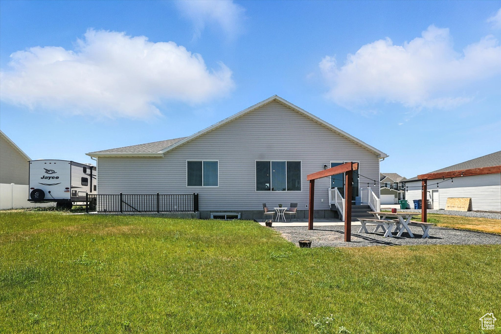 Rear view of house with a patio