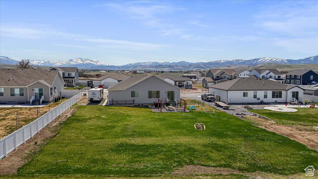 Exterior space with a residential view and a mountain view