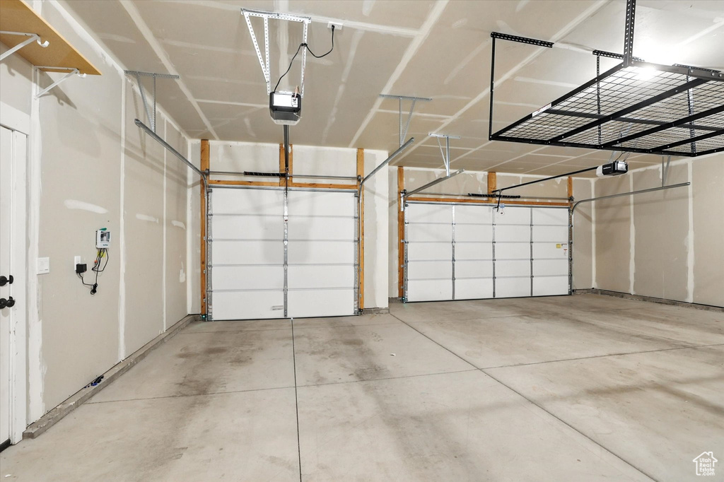 Garage featuring a garage door opener