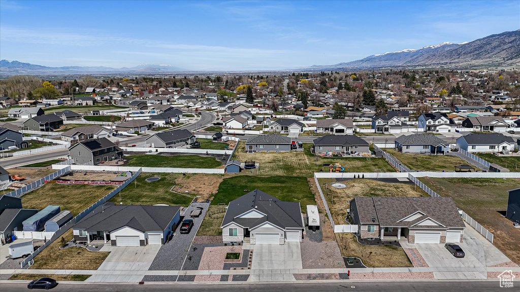 Aerial perspective of suburban area featuring a mountainous background