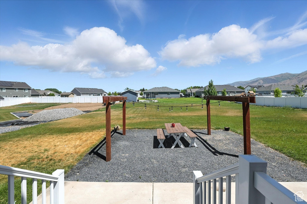 View of yard with a residential view and a mountain view