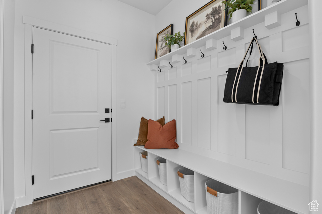 Mudroom with baseboards and wood finished floors