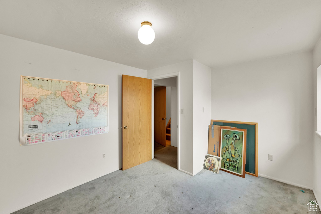 Unfurnished room with carpet