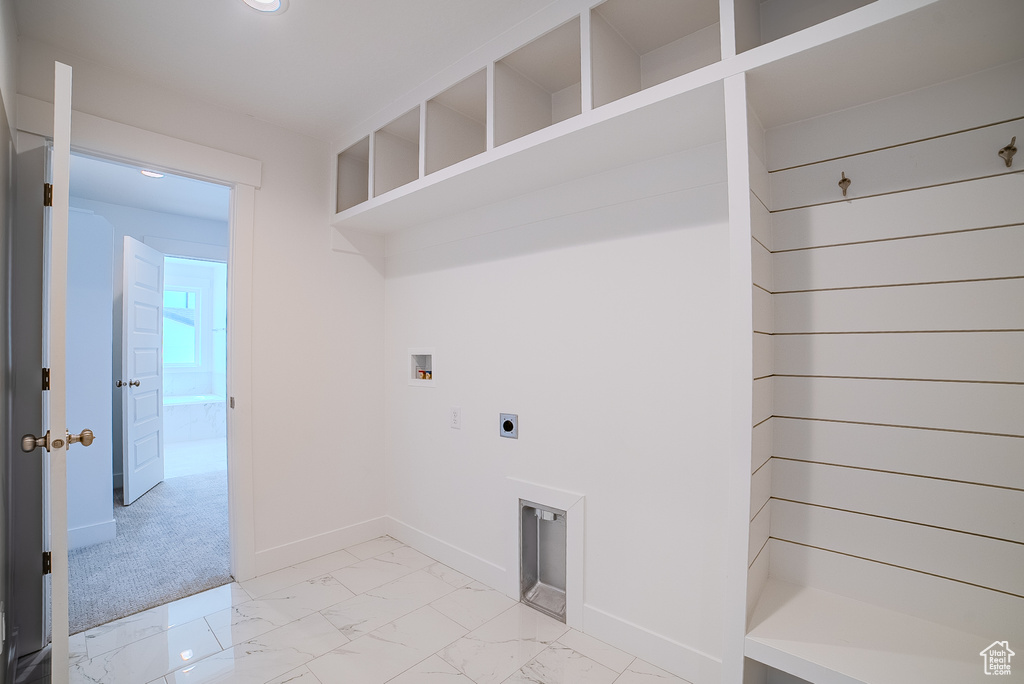 Washroom with laundry area, marble finish floor, baseboards, hookup for a washing machine, and hookup for an electric dryer