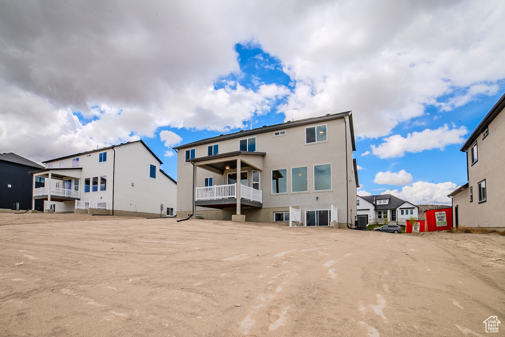Rear view of house with a residential view and a balcony