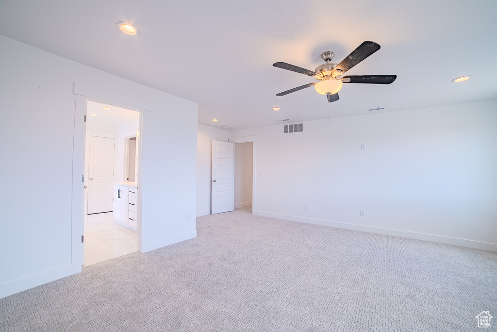 Unfurnished bedroom with recessed lighting, visible vents, and light carpet
