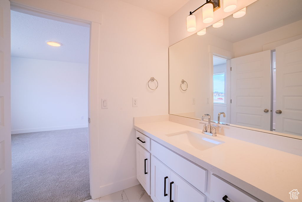 Bathroom with baseboards and vanity