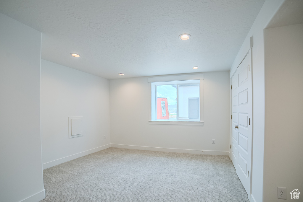 Unfurnished bedroom with recessed lighting, carpet, and baseboards