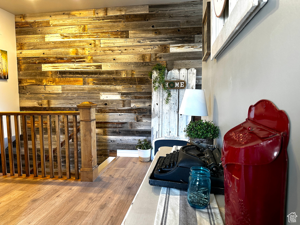 Interior space featuring wooden walls and wood finished floors