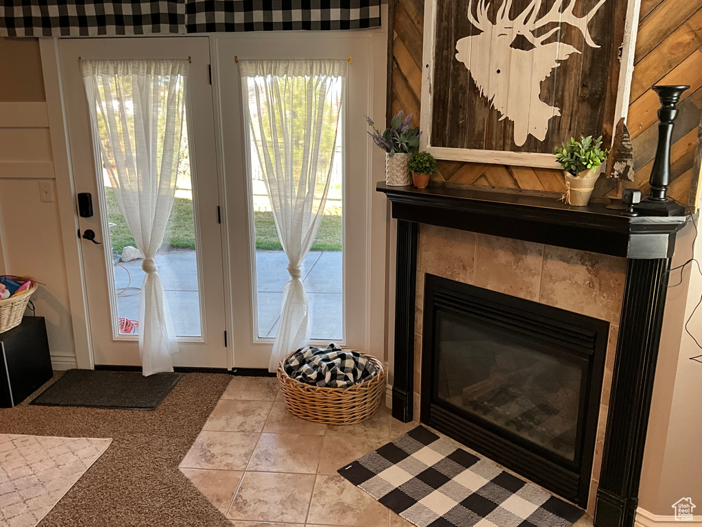 Doorway featuring a tile fireplace