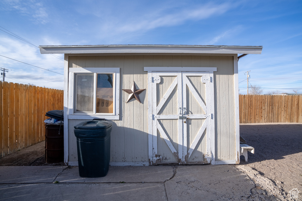 View of shed featuring a fenced backyard
