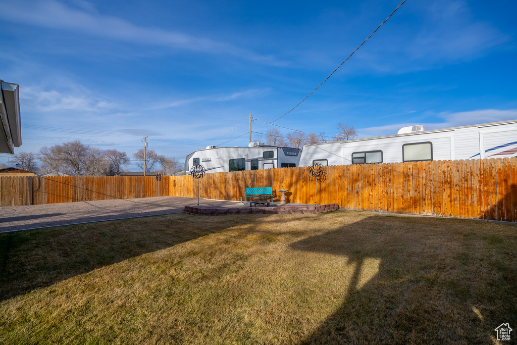 View of yard with a fenced backyard
