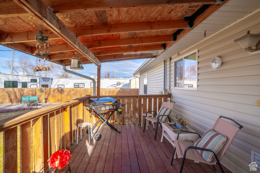 Deck with area for grilling and fence