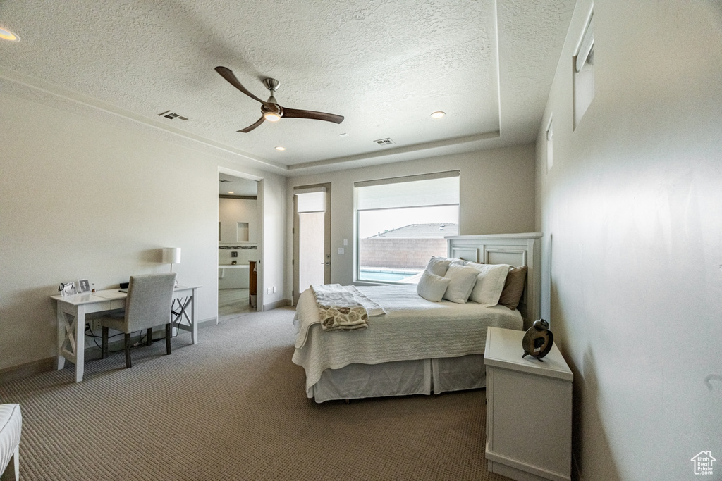 Bedroom featuring baseboards, visible vents, carpet, and a textured ceiling
