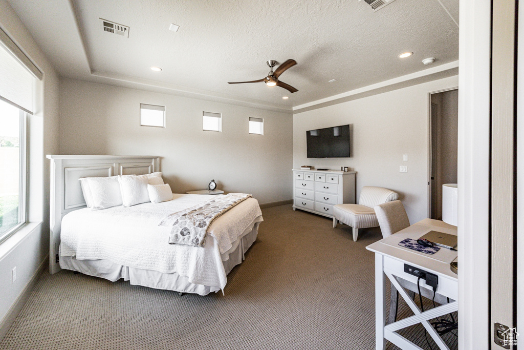 Bedroom featuring visible vents, carpet floors, recessed lighting, and a textured ceiling