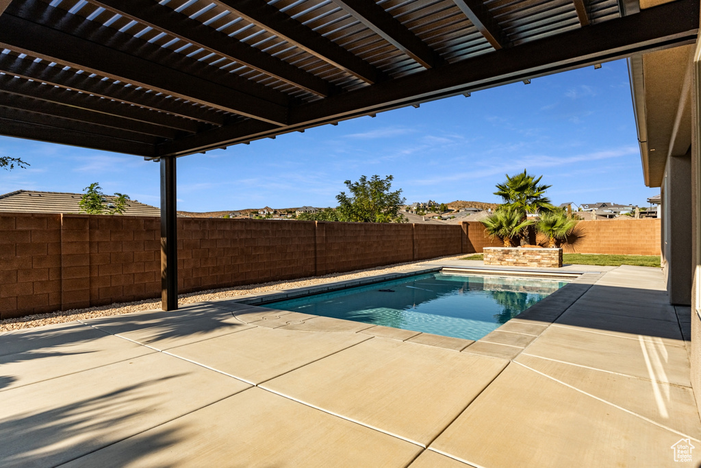 View of pool with a fenced backyard, a fenced in pool, a patio, and a pergola
