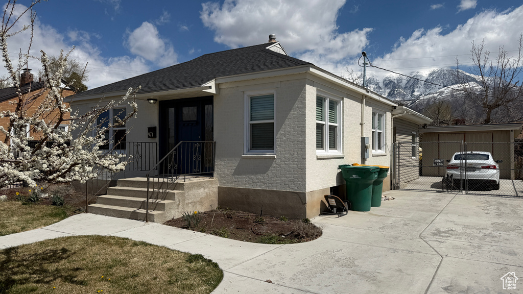 Bungalow with fence and brick siding