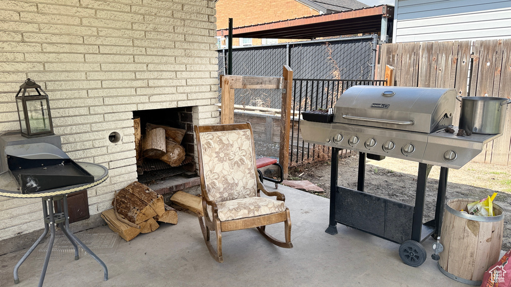 View of patio / terrace featuring grilling area and fence