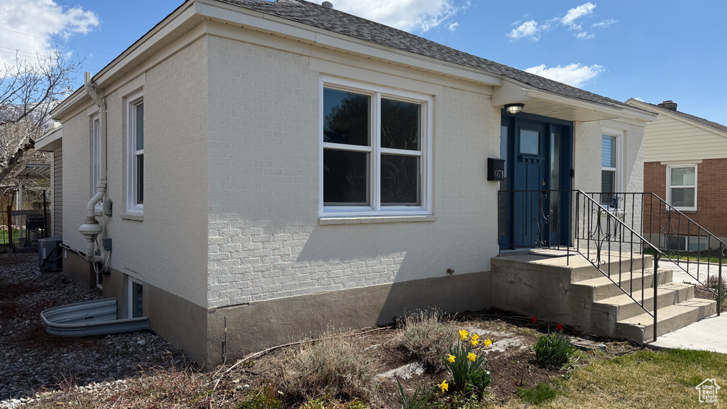 View of front of house with brick siding
