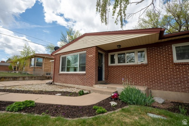 View of front of house featuring brick siding