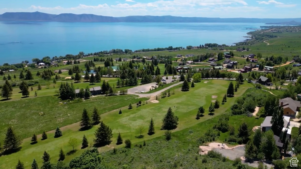View of property location with a water and mountain view