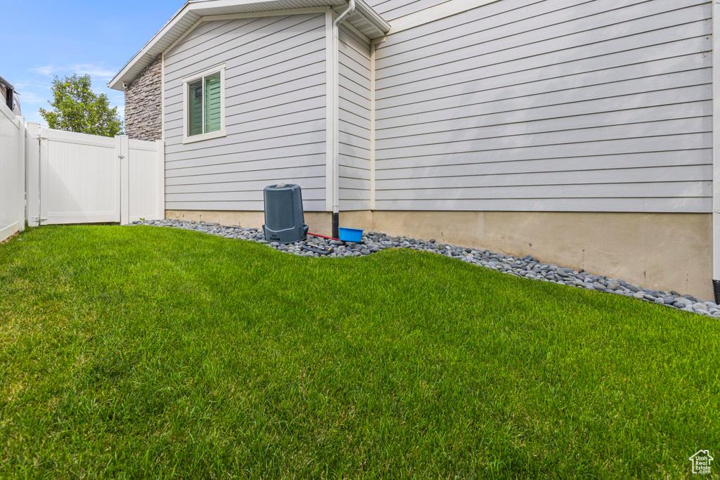 View of side of home with cooling unit