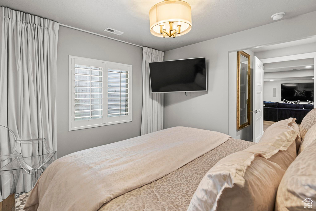 Bedroom with a chandelier