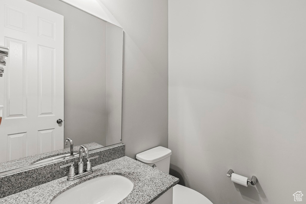 Bathroom with toilet and vanity