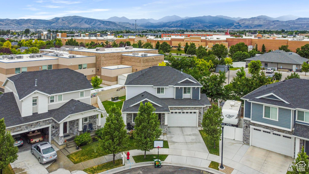 Aerial perspective of suburban area with a mountain backdrop