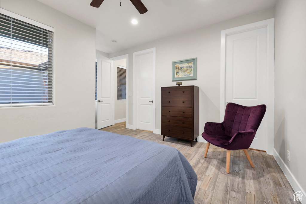 Bedroom featuring recessed lighting, baseboards, a ceiling fan, and wood finished floors