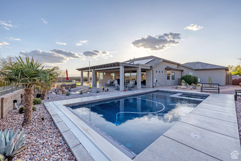 View of pool with outdoor dining space, a patio area, a fenced backyard, and a fenced in pool