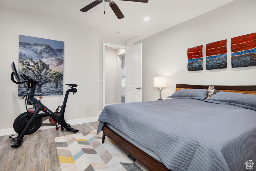 Bedroom featuring recessed lighting, light wood finished floors, baseboards, and ceiling fan