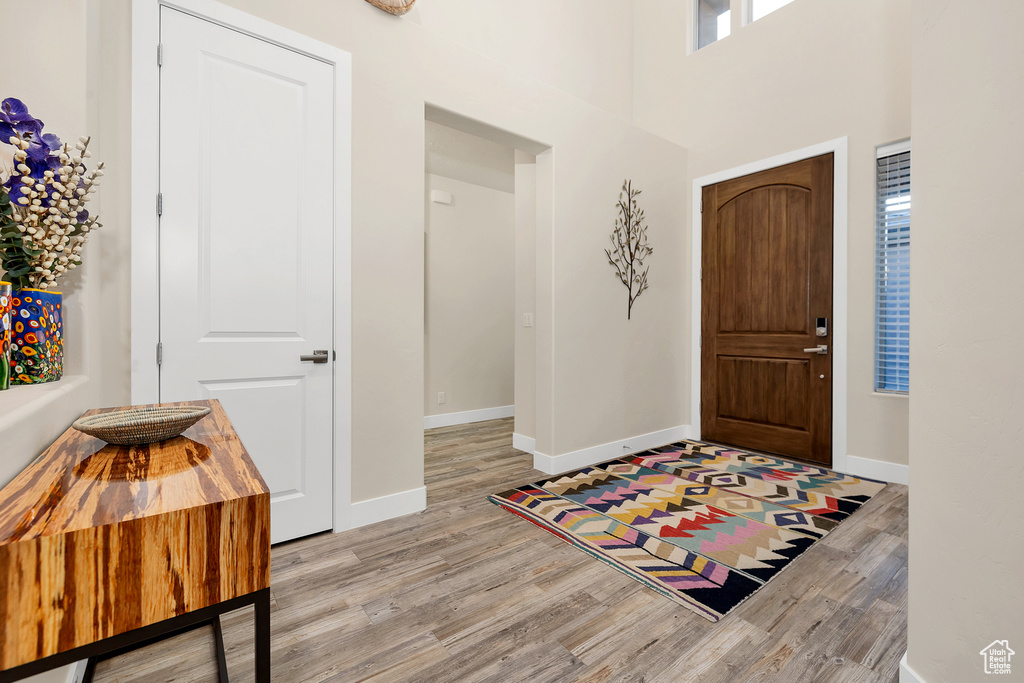 Entrance foyer featuring light wood-style floors and baseboards