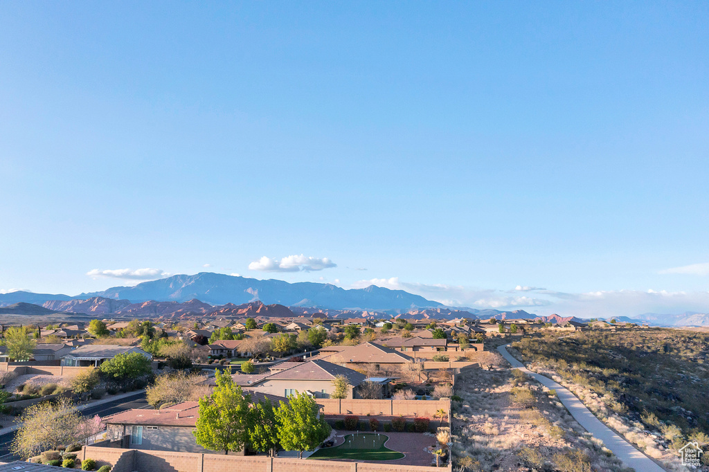 Property view of mountains with a residential view