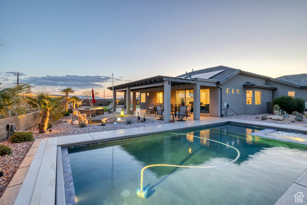 View of pool featuring a fenced in pool, a patio area, a fenced backyard, and outdoor dining space