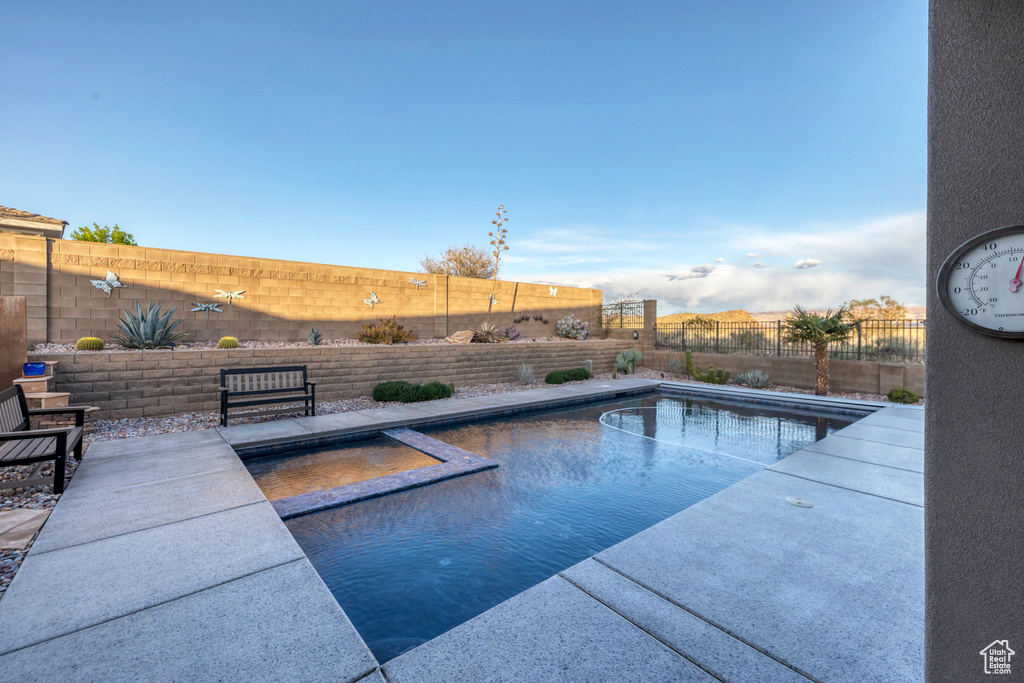 View of pool featuring a fenced backyard, a fenced in pool, and a patio