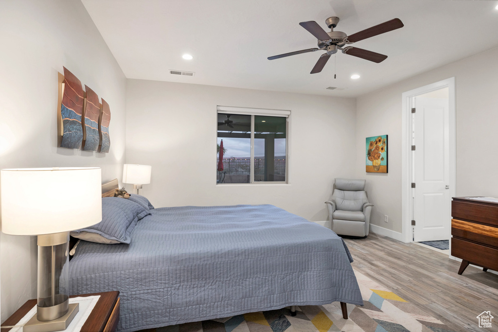 Bedroom featuring visible vents, baseboards, recessed lighting, and wood finished floors