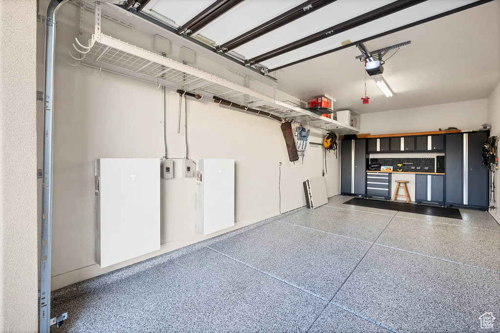 Garage featuring a garage door opener