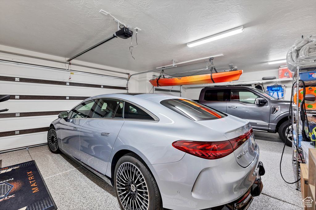 Garage featuring a garage door opener