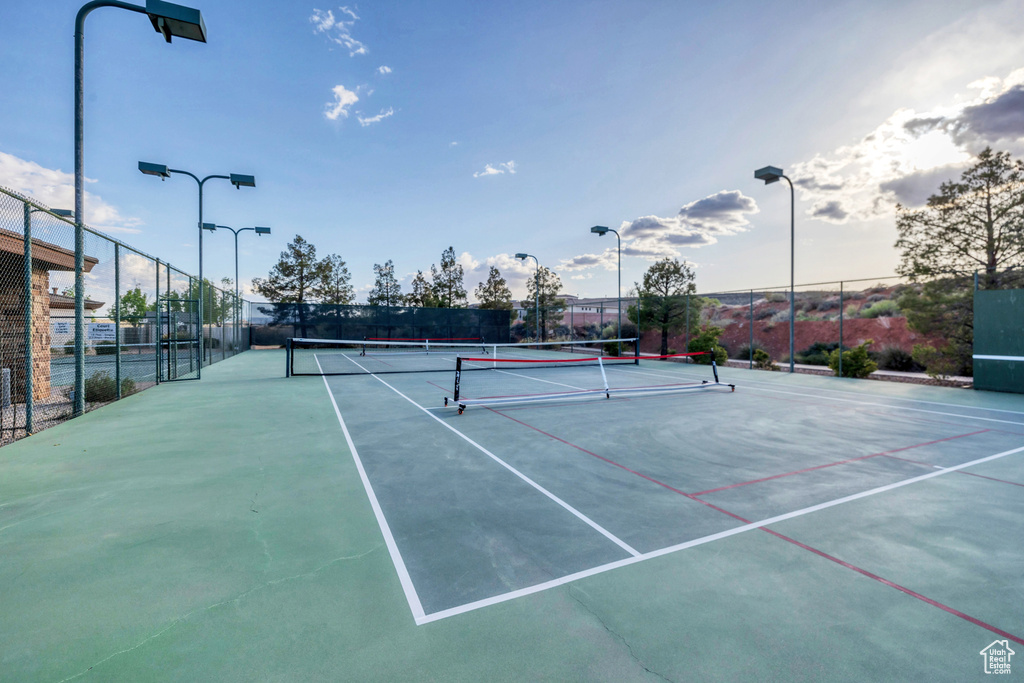 View of sport court featuring fence