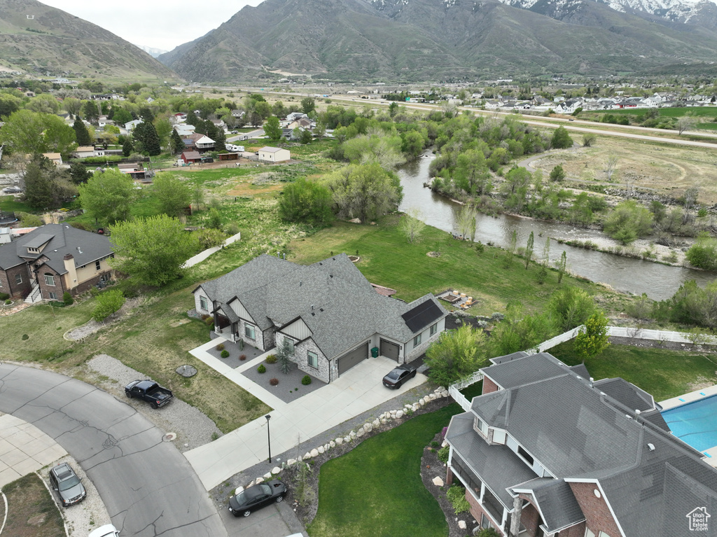 Drone / aerial view with a residential view and a mountain view