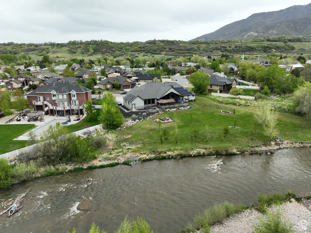 Drone / aerial view featuring a mountain view and a residential view