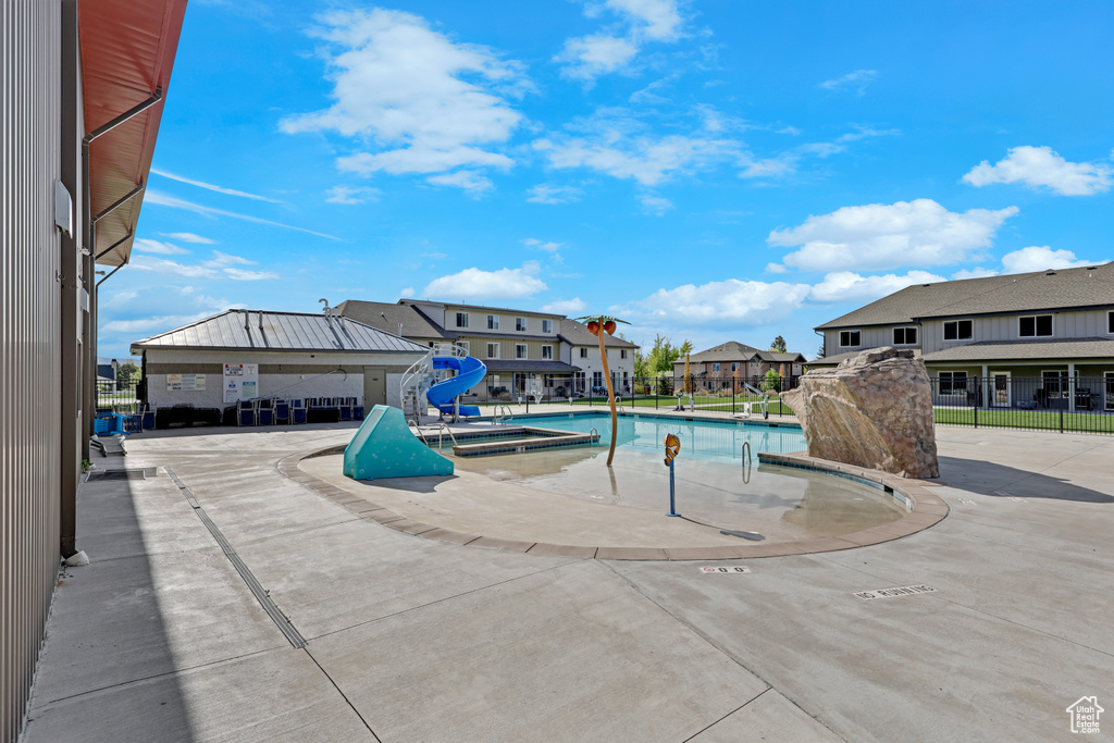 Community pool featuring a residential view and a patio
