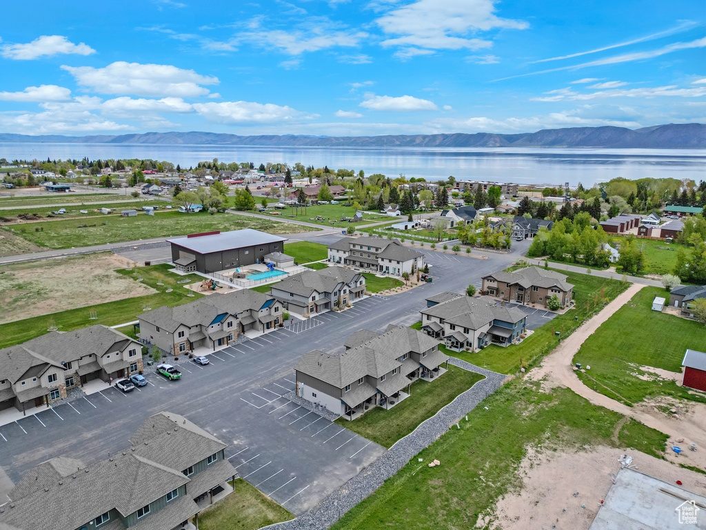 Aerial view of residential area featuring a water and mountain view